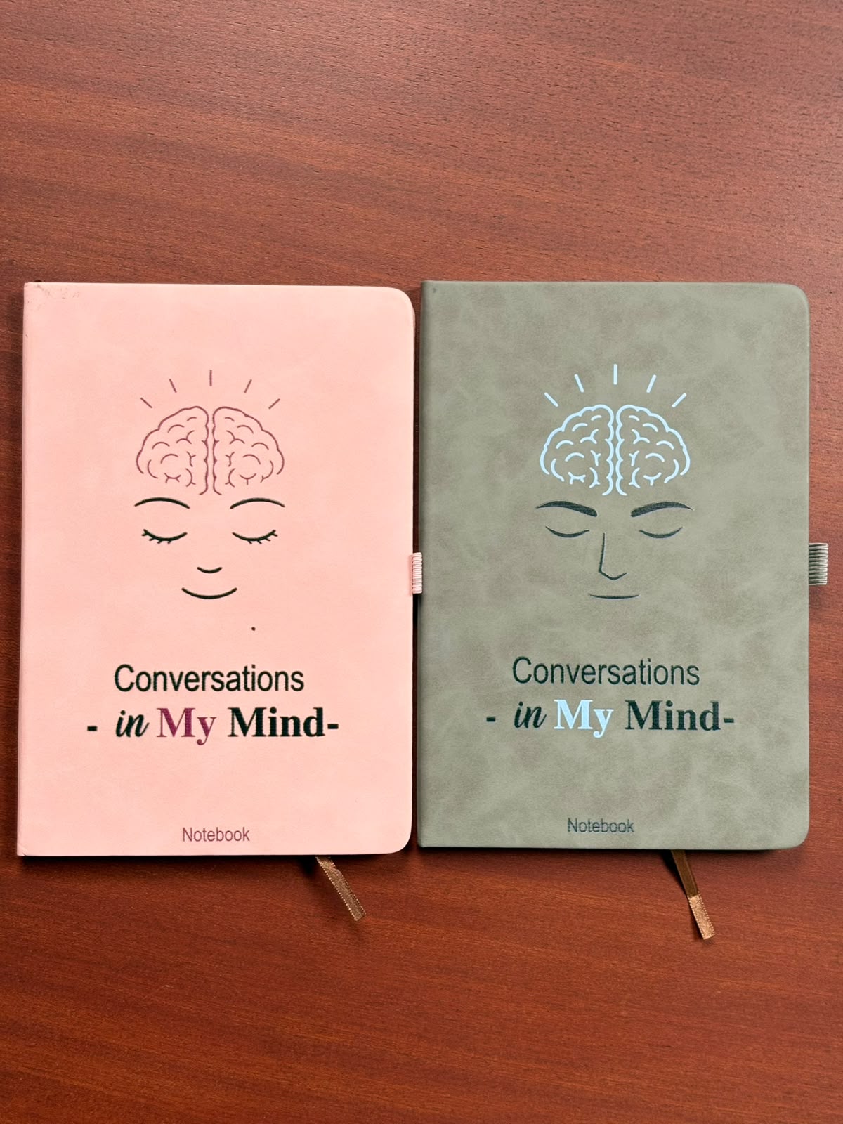 Pink and grey Conversations in My Mind notebooks side by side